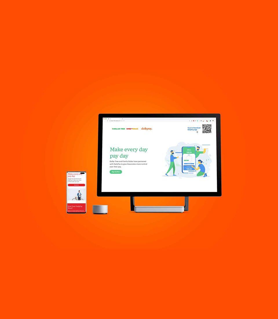 A DailyPay landing page on a desktop monitor, with a phone beside it, on an orange background