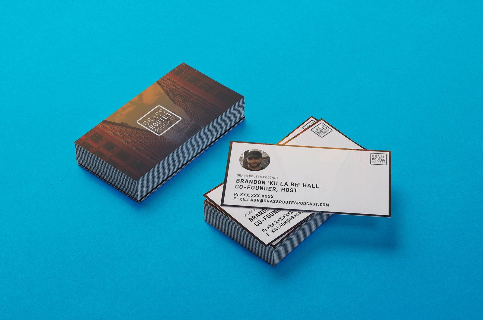 Grass Routes Podcast business cards for Brandon Killa BH Hall, co-founder and host, on a blue background