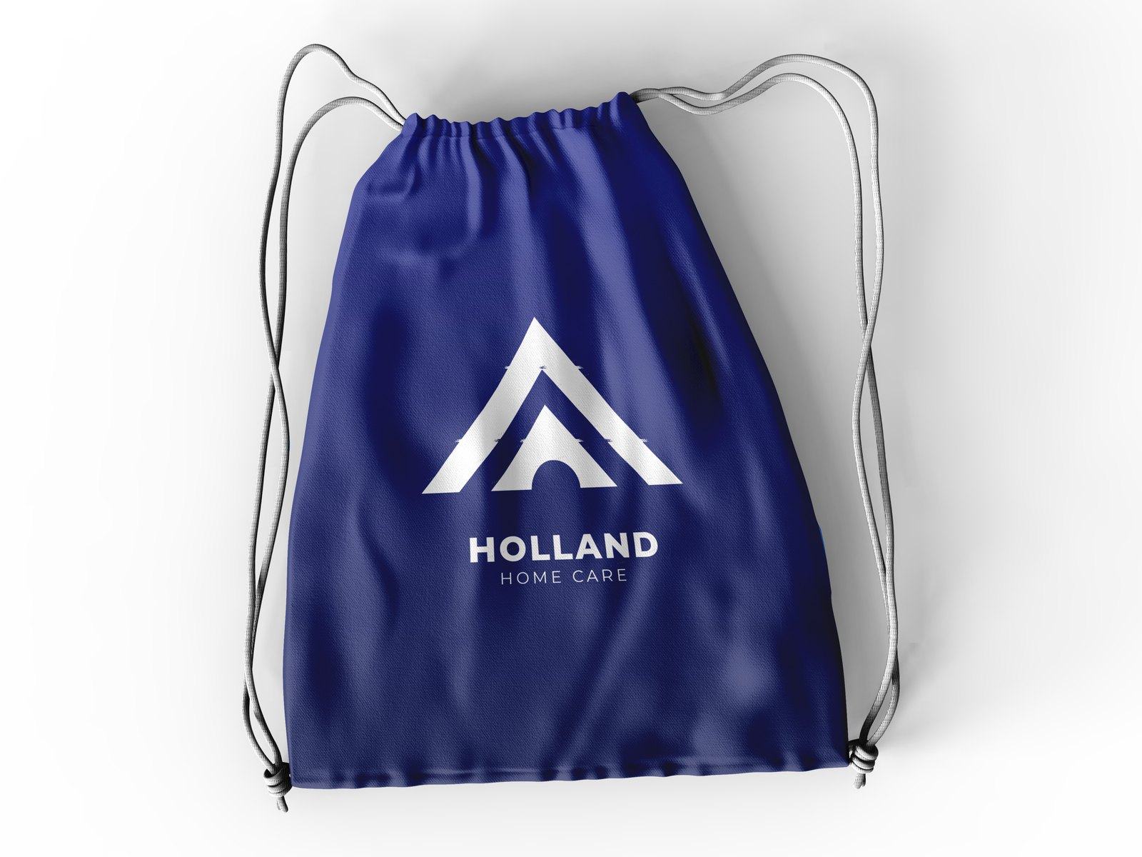 Navy drawstring bag with the Holland mark in white