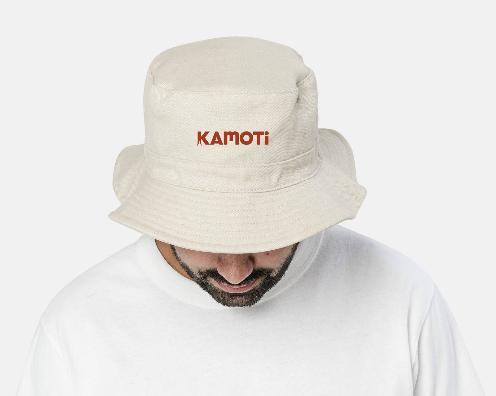 Cream bucket hat with the Kamoti wordmark in red
