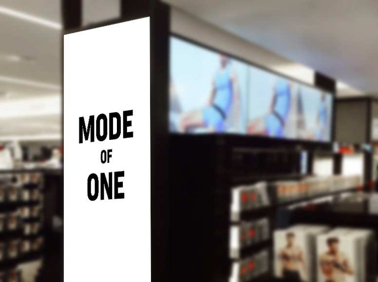 Store render: a white Mode of One display panel beside the shelves