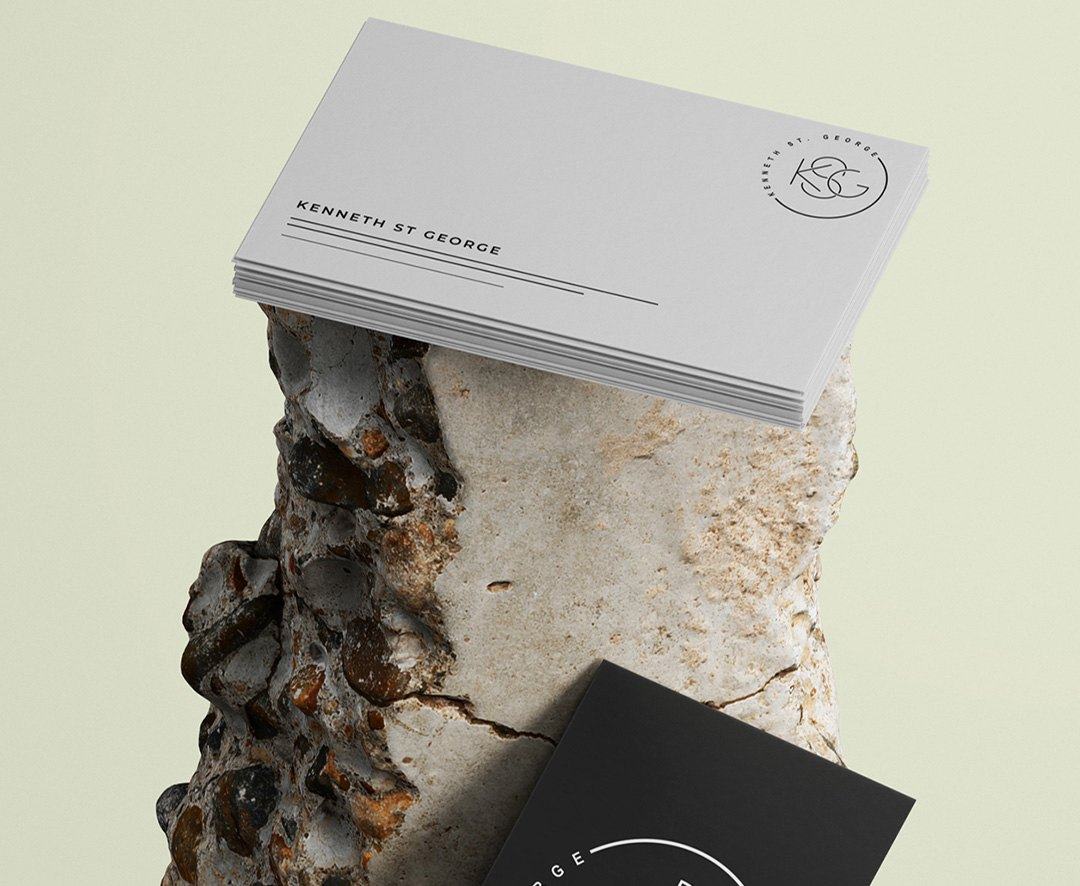 KSG business cards resting on a rough stone