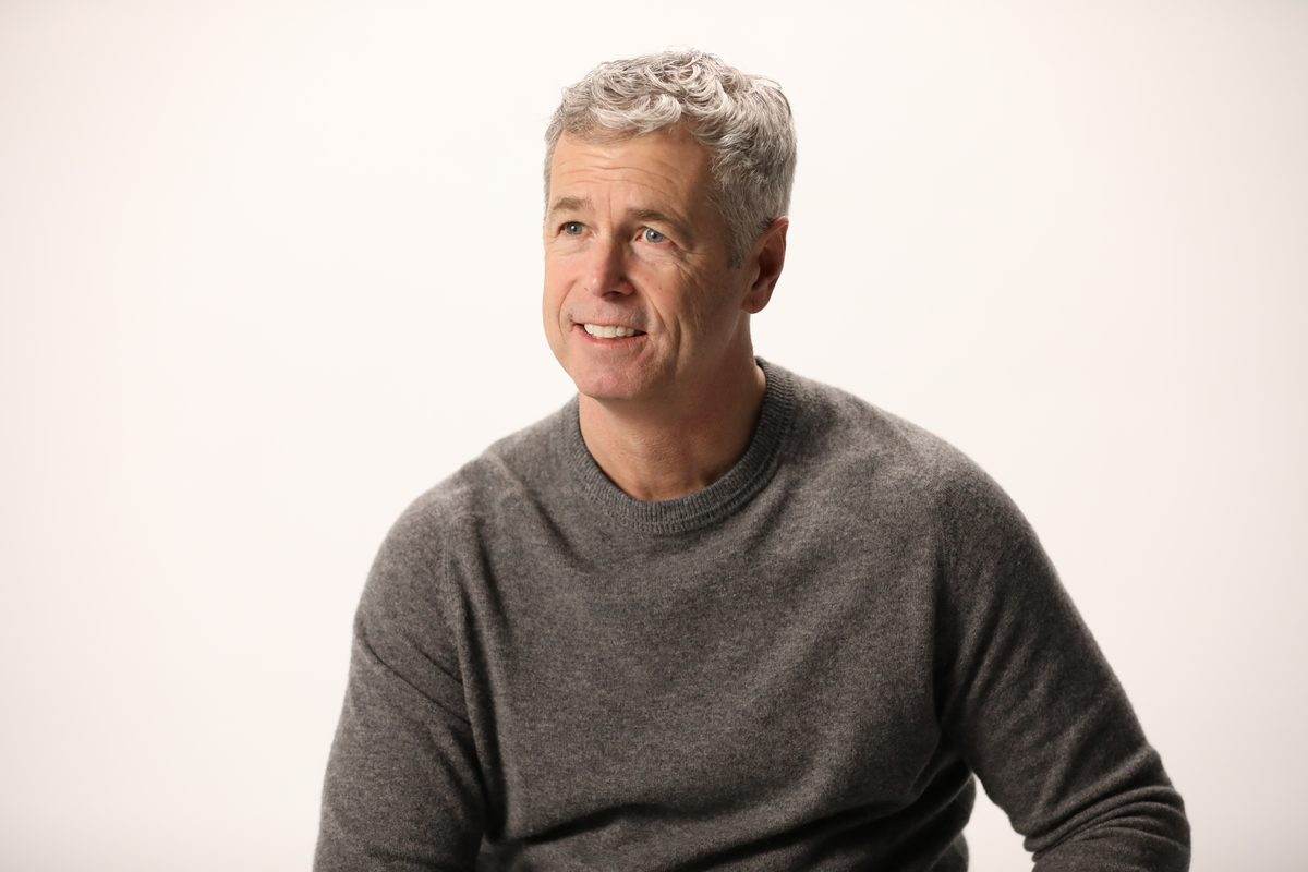 A man with grey hair in a grey sweater, from the LetsGetChecked photoshoot